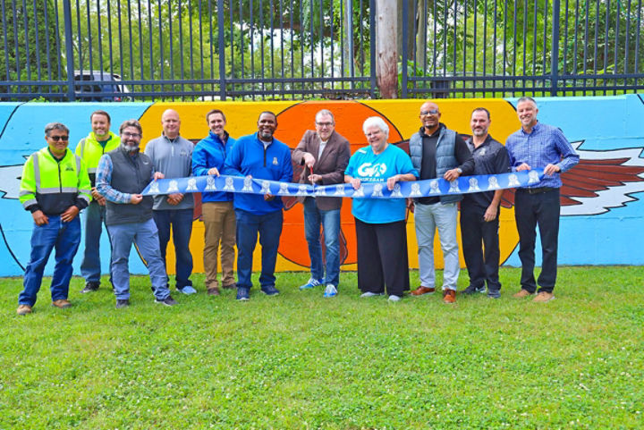 Mural unveiling in Waukegan with IAC Program Director, John Gawlik (center)
